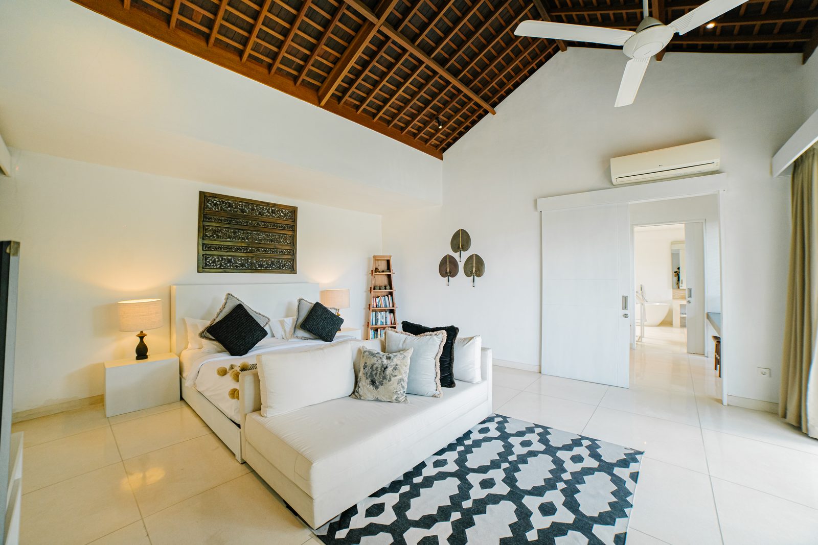King Master Suite with thatched ceiling at CassaMia Bali villa, Jimbaran